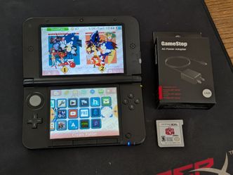 Nintendo 3DS XL Black Handheld Console with 64 GB SD Card and Charger