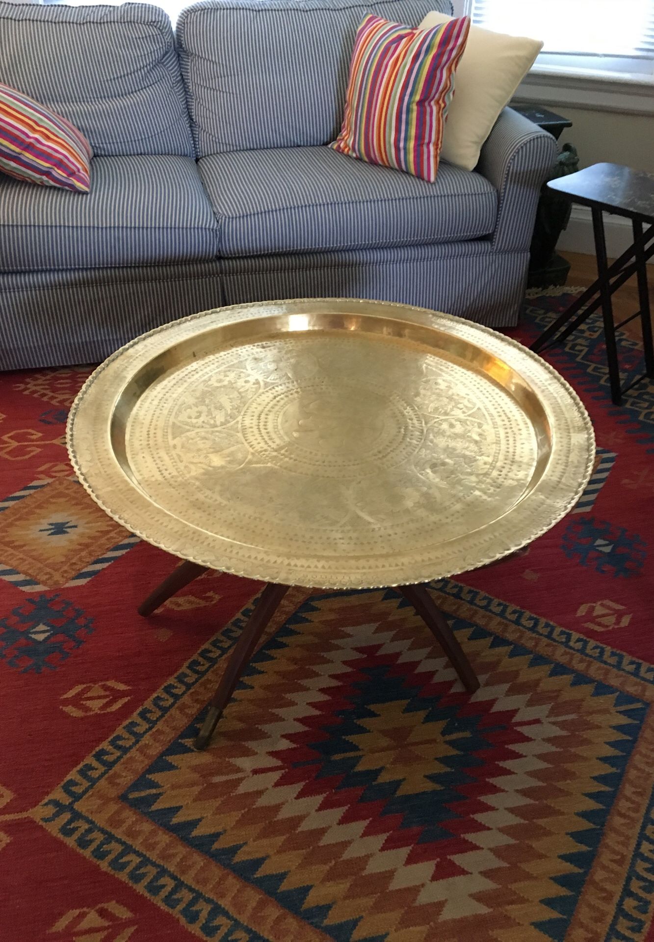 Solid brass tray/coffee table with legs. The tray is removable and can be used as a wall hanging. Made in Taiwan 1967 purchased there and brought hom
