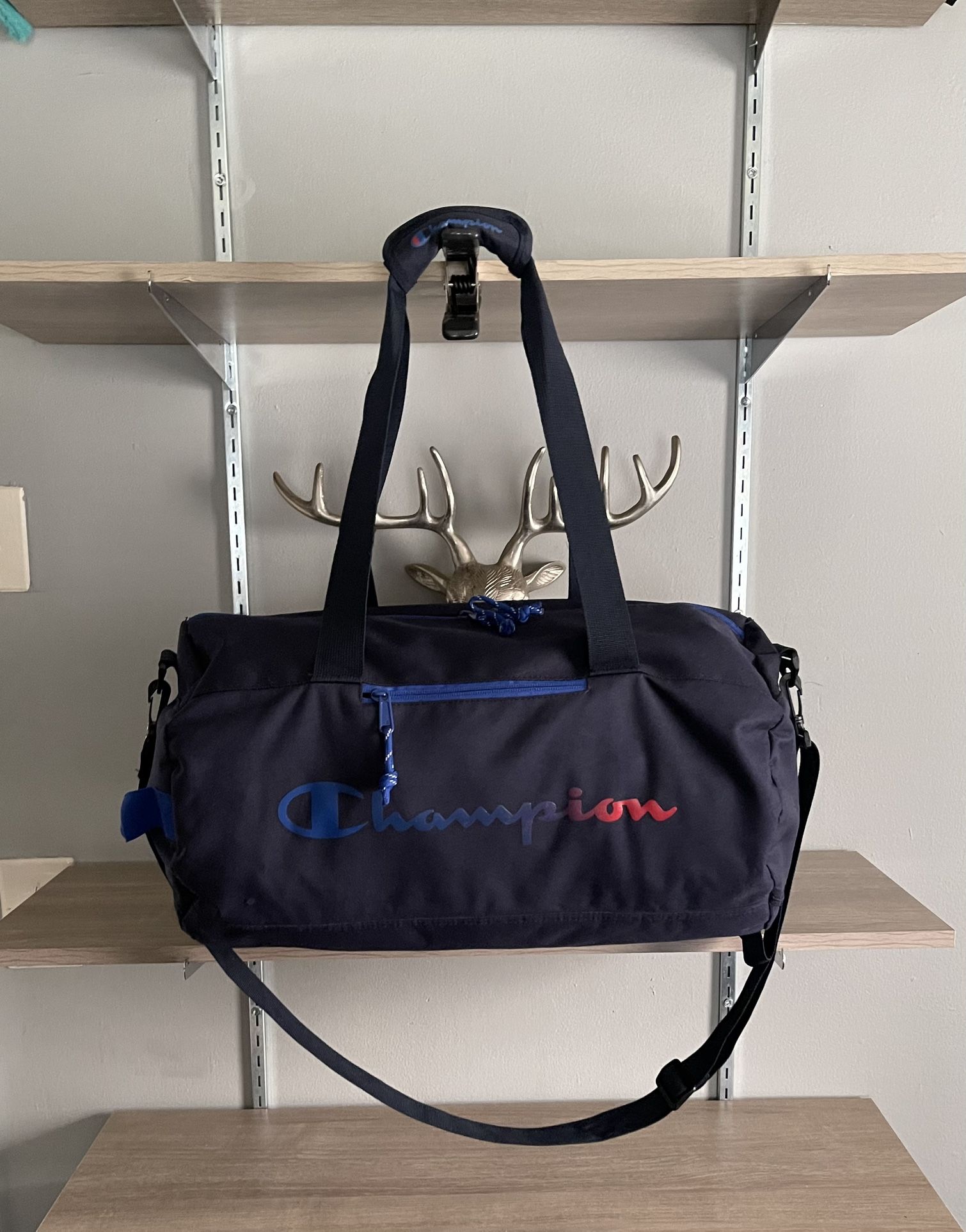 Men’s Champion Large duffel bag with adjustable Crossbody strap. Retail $48. Has one flaw as pictured other than that great condition. Color navy blue