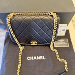 Authentic Chanel Medium Black Flap Bag With Gold Shoulder strap chains.