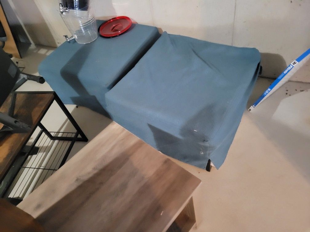 Green ottoman With built on bed