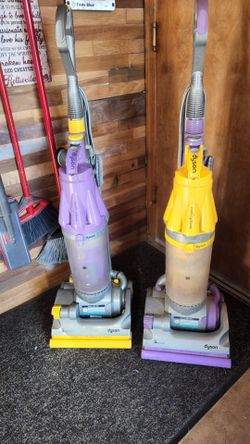 2 Dyson vacuum cleaners
