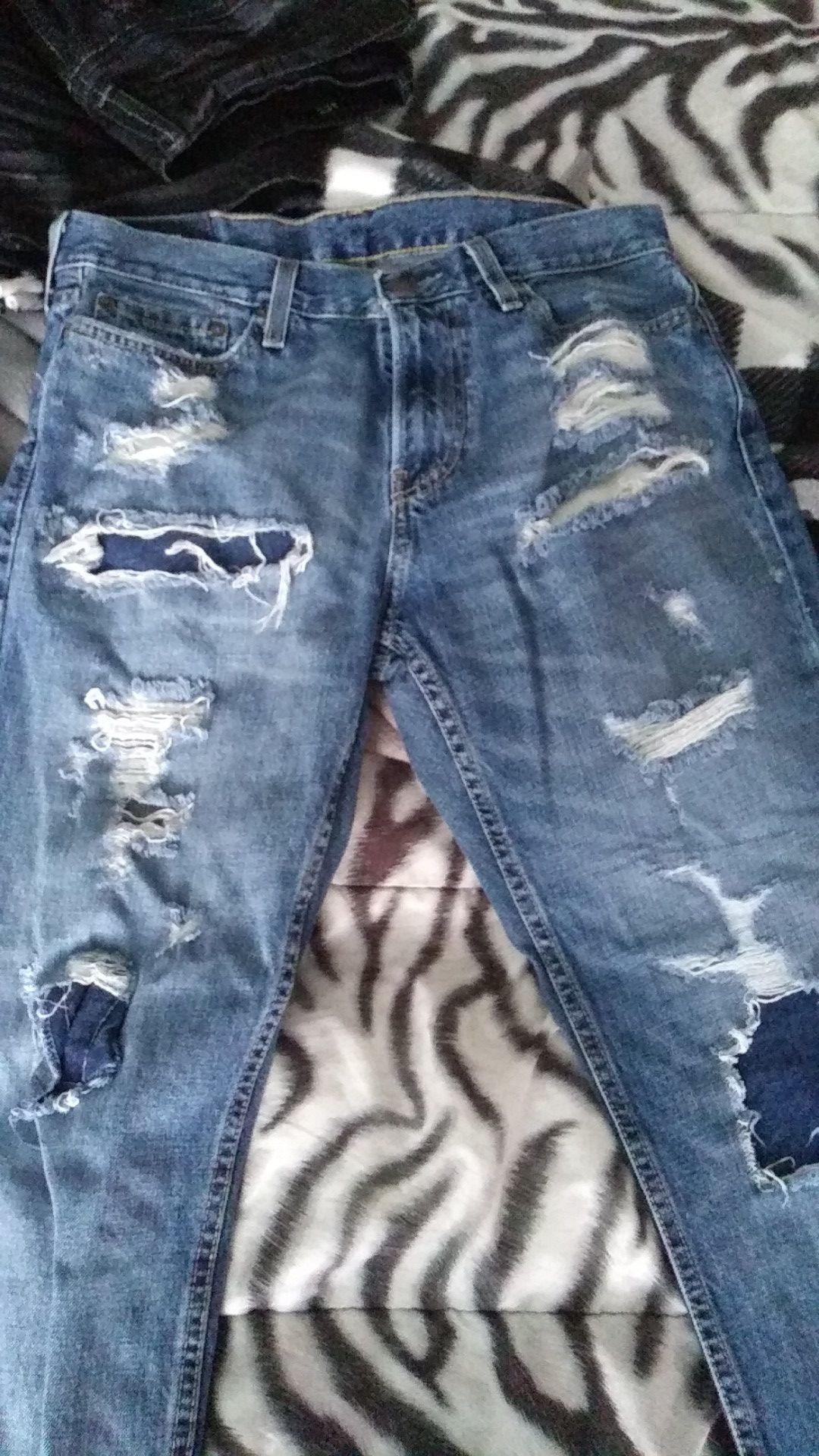 Ive got 6 pair of jeans..american eagle..flypaper..true luck..bigstar..levie....and a brand new pair of suede jordan tennis shoes!!!!