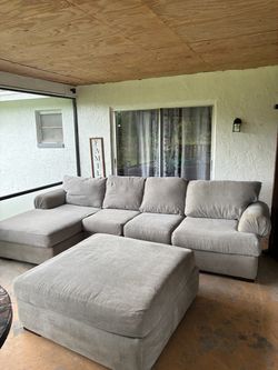 Gray sectional couch ottoman