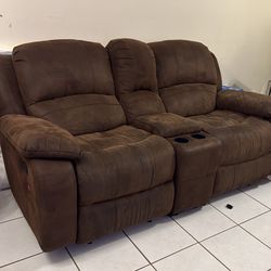 Two sofas with cupholders