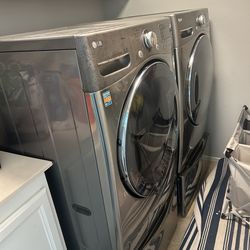 Front load washer and dryer with pedestal