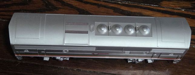 Lionel 6-18115 Santa Fe F-3 B Unit diesel locomotive, featuring silver paint with red, yellow, and black stripes.