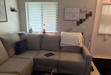 Grey 2 piece sofa sectional with nail head