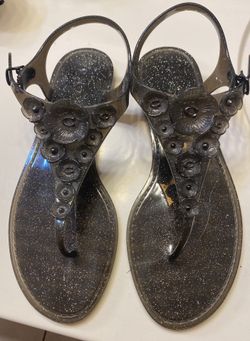 Coach glittery black jelly sandals. Signature Coach C logo in middle of flower.