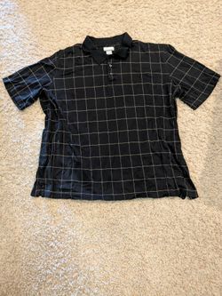 Used black and gold polo shirt
