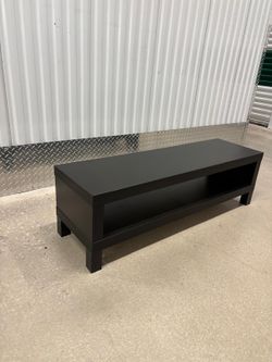 Chocolate brown TV stand 48 inches wide , 14 inches depth and 14 inches high $40