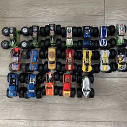 Set of 19 monster jam trucks from hot wheels these are the smaller 1/64 scale trucks. 
