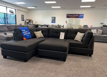 104'In Wide Reversible Black Sectional sofa with ottoman