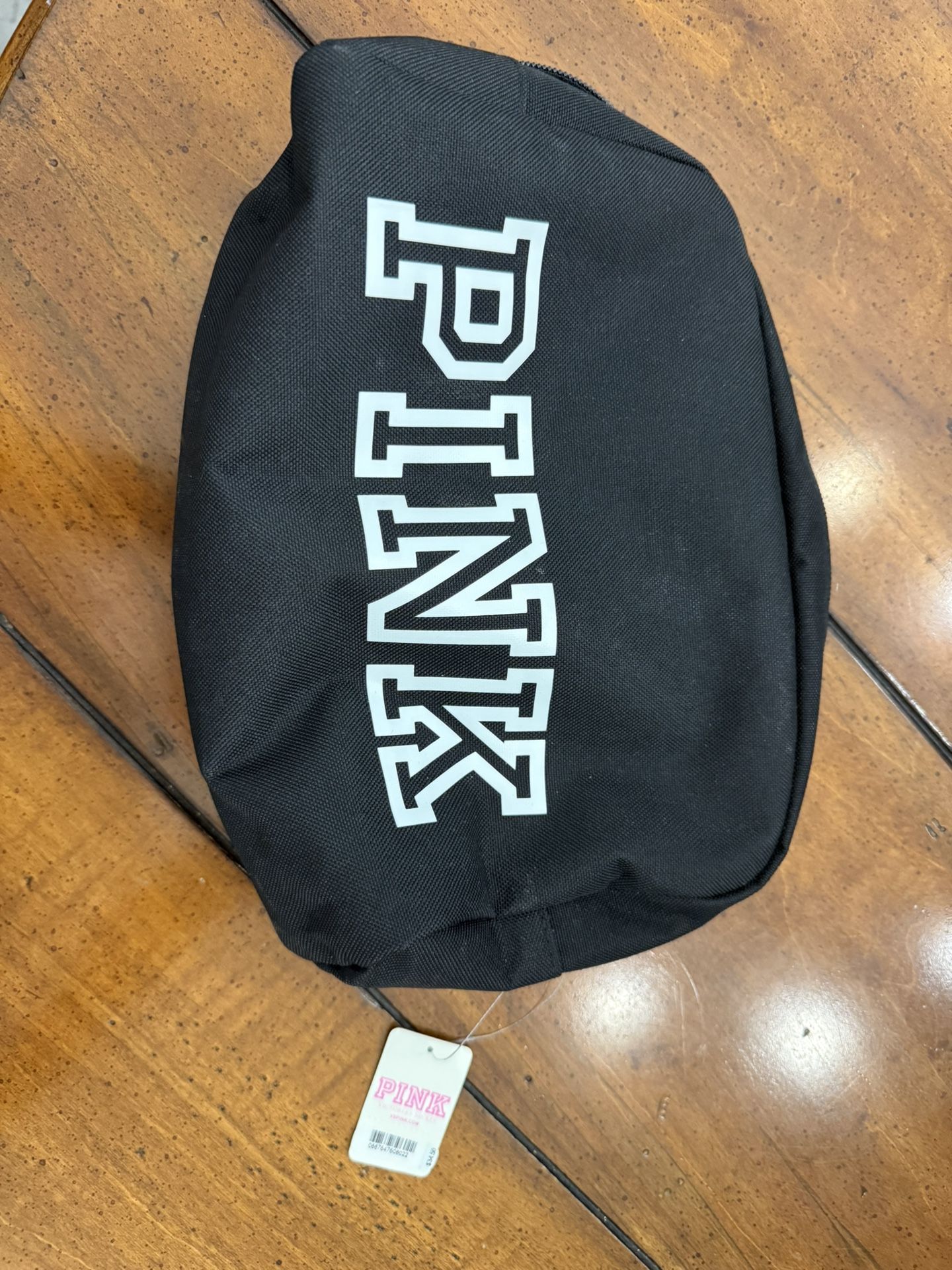 Brand new pink cosmetic bag. Comes with plastic lining. comes from a smoke free home. Any questions feel free to ask.