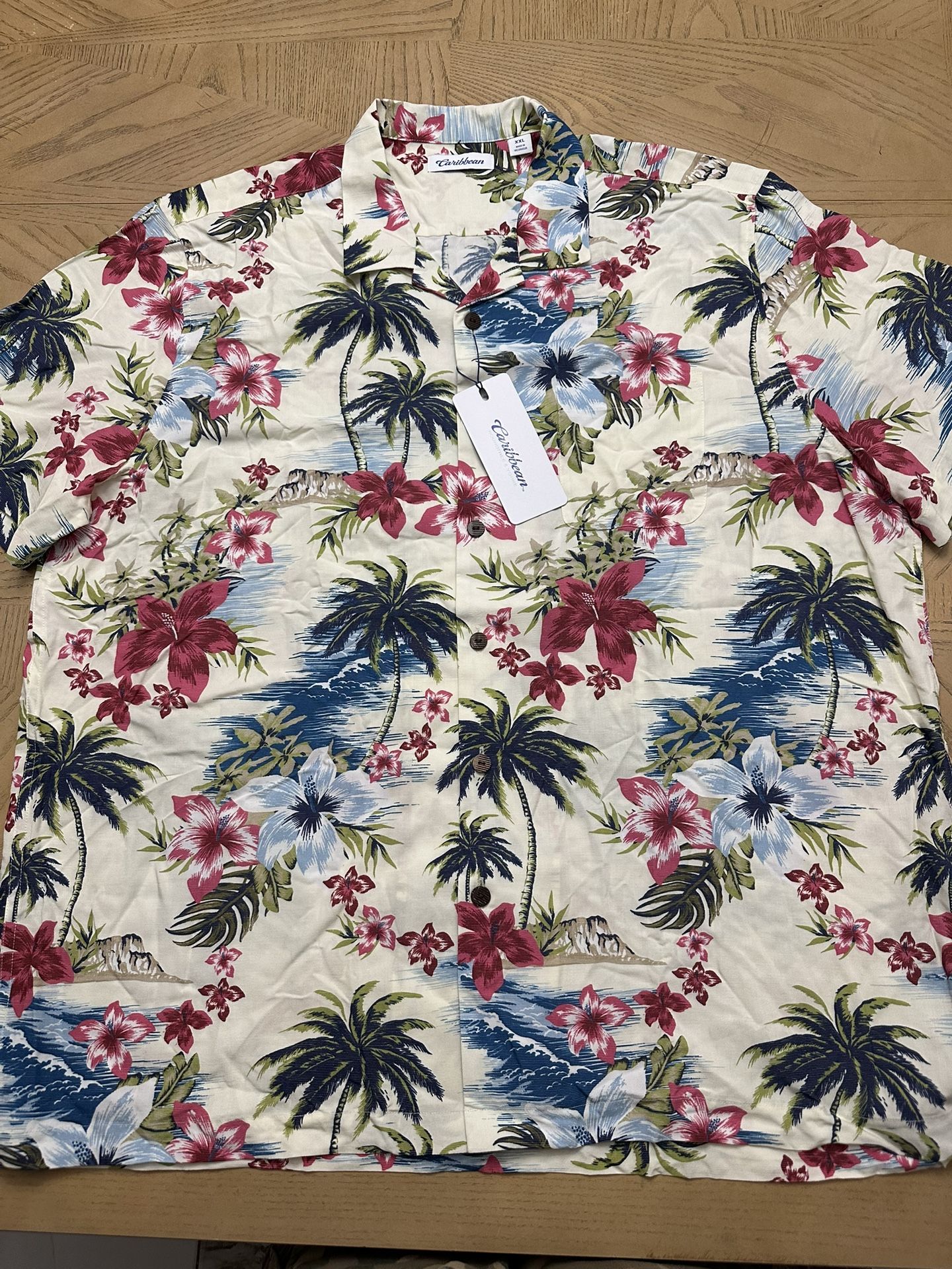 Caribbean Joe Hawaiian shirt with a tropical hibiscus and palm tree print.