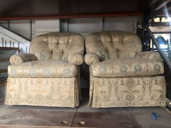 Swiveling upholstered barrel chair set
