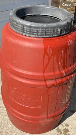Large red rain barrel