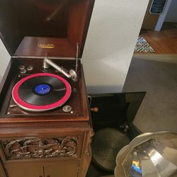 1890's Regina company music box with Morning Glory Horn and silvertone cabinet with 193 records