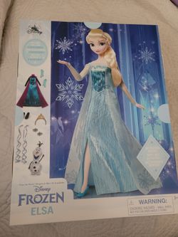 Disney  Frozen  Elsa Story Doll with accessories and activities.  Brand new