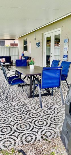 Outdoor dining table with six new chairs