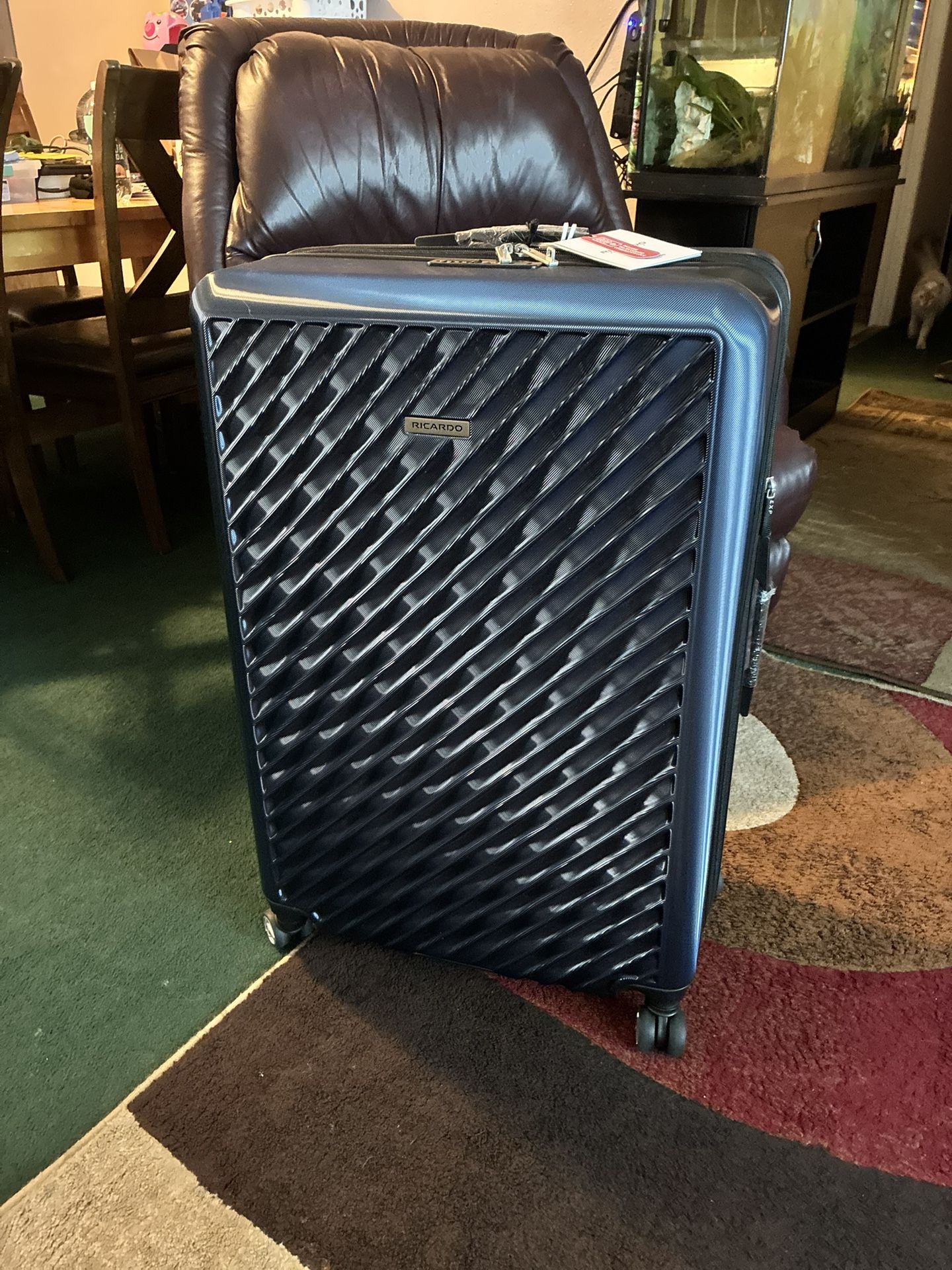 $120 Extra large lockable hard shell suitcase on wheels brand new never used plastic and tags still on it. Downsizing extras- got last year never used