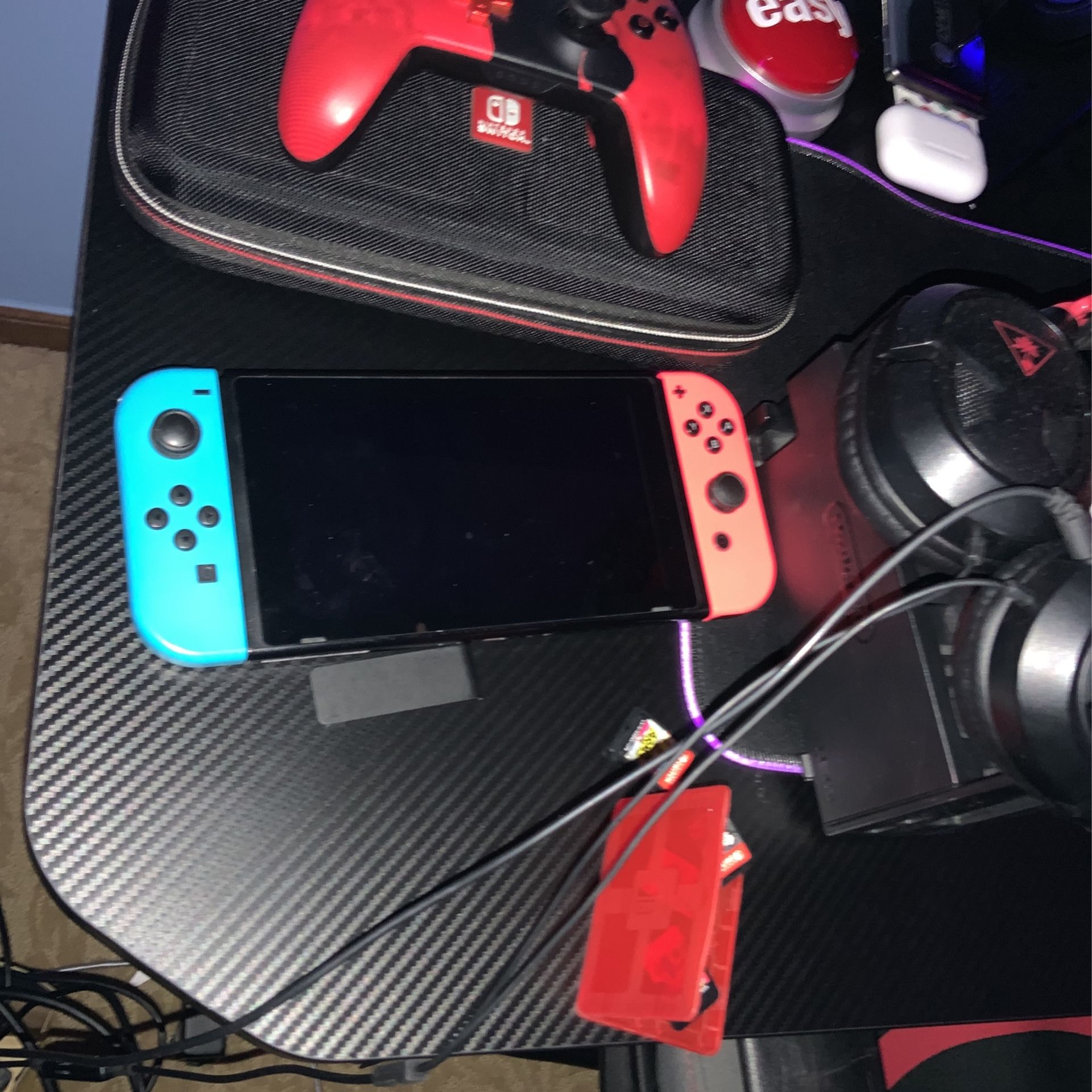 NINTENDO SWITCH WITH CONTROLLER CASE HEADPHONES AND 5 GAMES