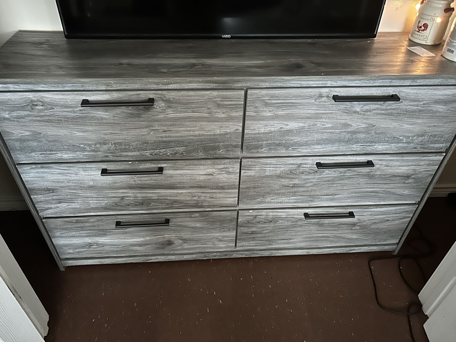 Wooden six drawer dresser also comes with a mirror