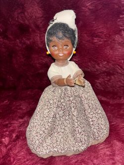 Gambina doll from New Orleans, Handcrafted and representing cultural figures like a "praline lady"