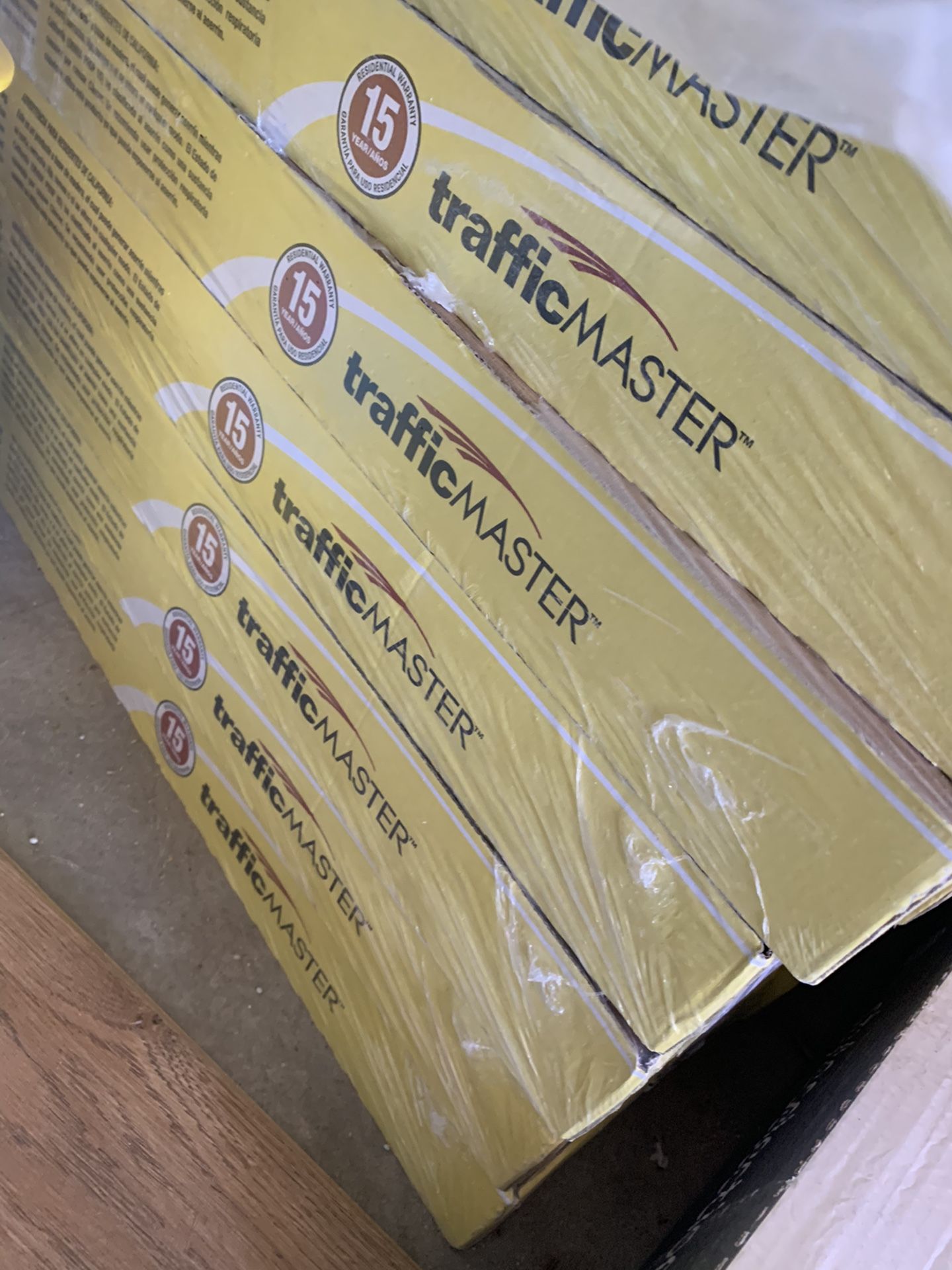 15 boxes (362 sq feet) traffic master flooring - plus a box of remnants