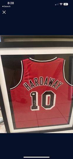 Tim Hardaway HOF signed jersey with sticker of Authenticity And COA