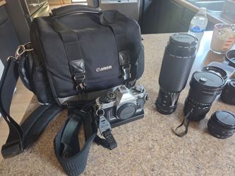 Cannon AE-1 Program 35mm Camera With Case and lenses vintage