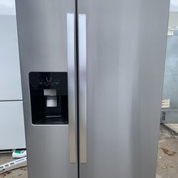 Like new stainless steel side-by-side whirlpool refrigerator