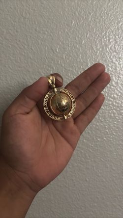 The world is yours gold pendant
