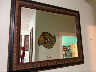 large, rectangular ornate wall mirror