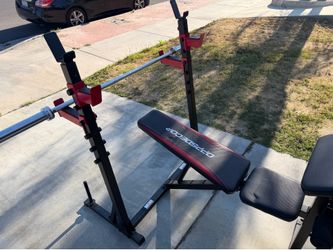Very nice looking Olympic weight bench that can adjust to 6 positions and brand new 6 ft Olympic barbell