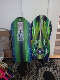 2 snow sledding boards