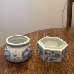 Two Blue And White Containers