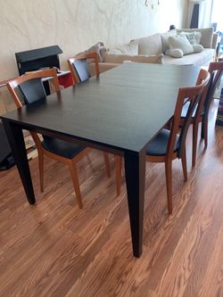 Solid black wood table w/extension and chairs