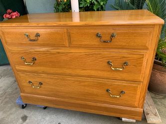 Vintage Ethan Allen chest of drawers  solid oak .