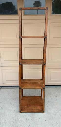 69inch Safavieh Asher 4-Tier Leaning Etagere featuring a rustic oak wood finish and a space-saving angled ladder design