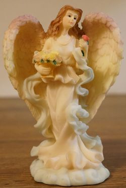 Angel holding Flowers
