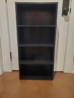 New black wood book shelf  w/4 shelves.