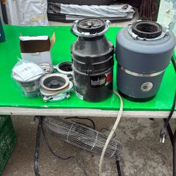 2 USED GARBAGE DISPOSALS USED