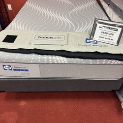 Queen Sealy Posturepedic Hybrid floor model