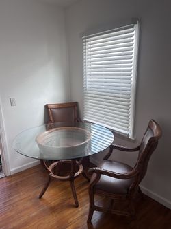 Round Glass Dining Table with 2 Leather Armchairs