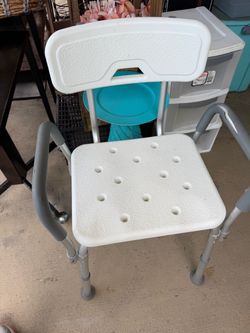 Near New adjustable shower chair, slight rip on one of the arm Picture