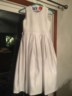 Beautiful white dress. First communion. Flower girl