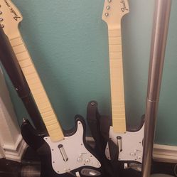 2 Rockband guitars and 1 Playstation 2 guitar