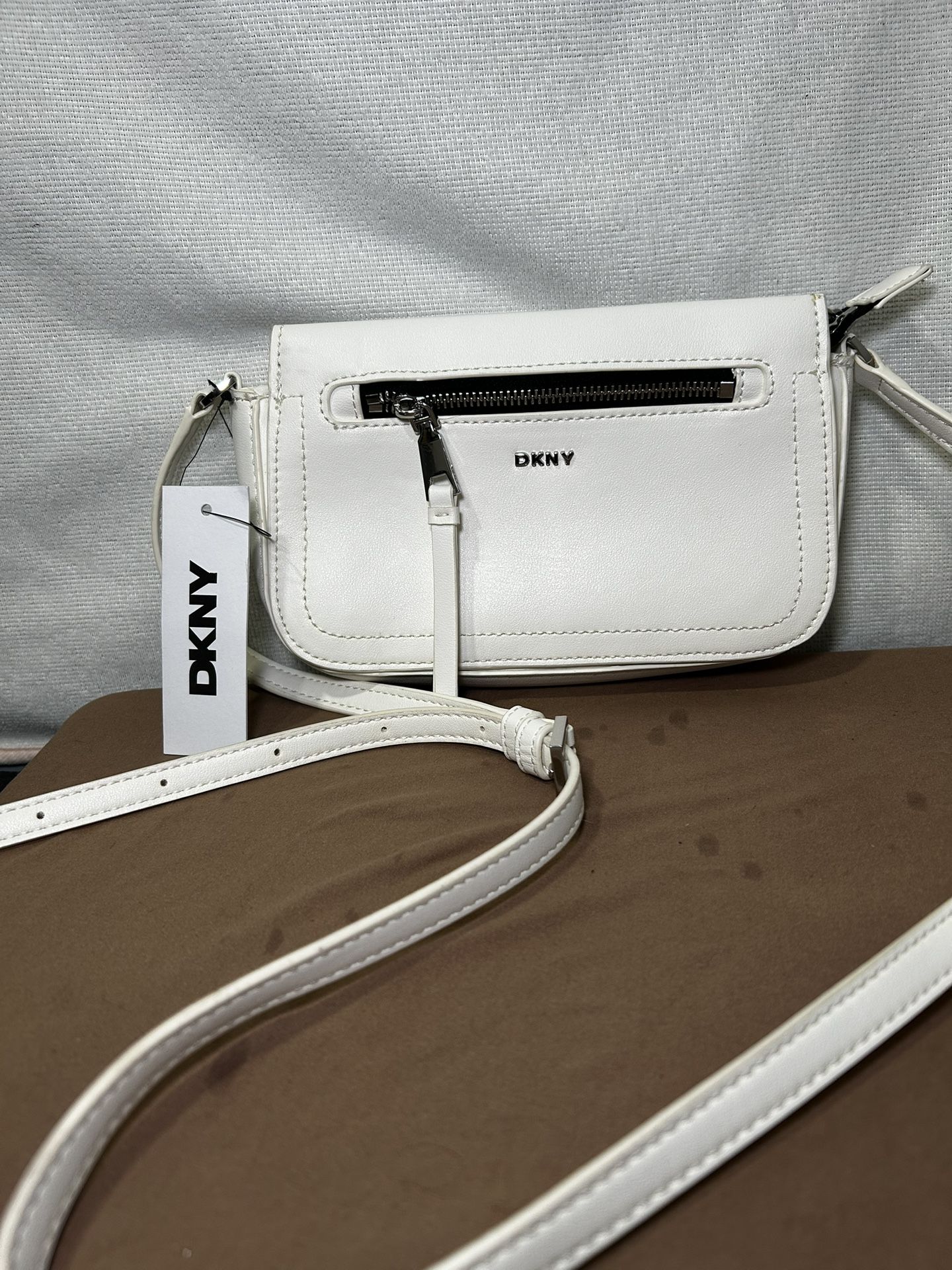 DKNY Pollee Tz white crossbody bag.