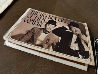 Oliver and Stan Set of pictures in newspaper print